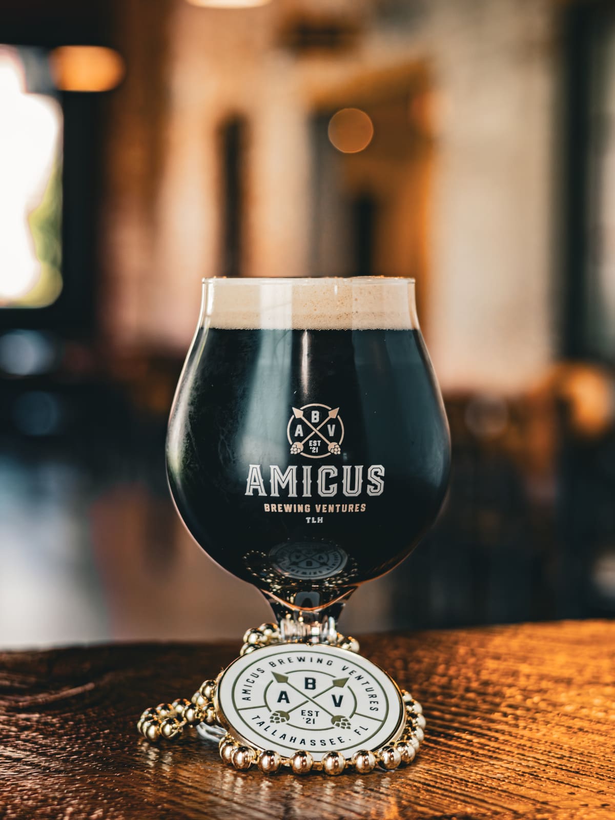 A dark beer with a tan head.